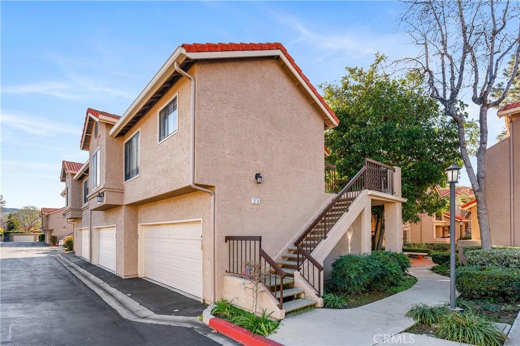 2368 Archwood Lane, Unit 23 Simi Valley, CA 93063 - Photo 1 of 1 a front view of a house with a yard
