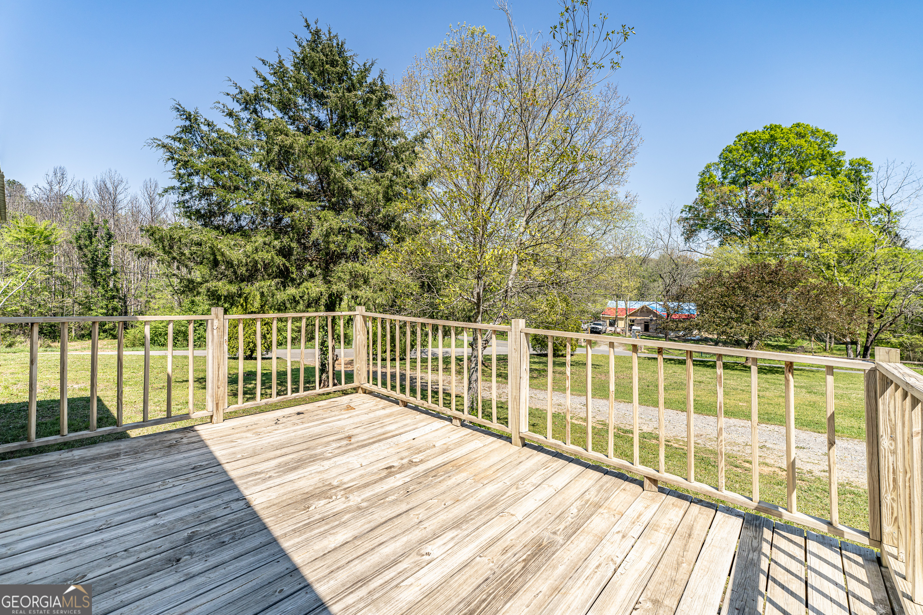 71 Kirk Road Northwest White, GA 30184 - Photo 3 of 43 a view of balcony with wooden floor and fence