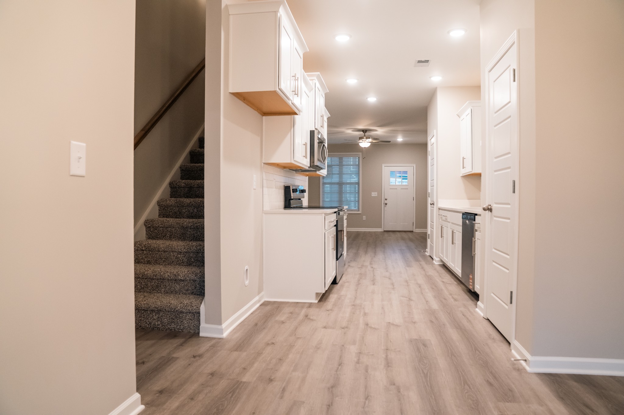 337 Carver Connection, Unit 33 Lebanon, TN 37087 - Photo 6 of 21 a view of a kitchen with wooden floor and electronic appliances