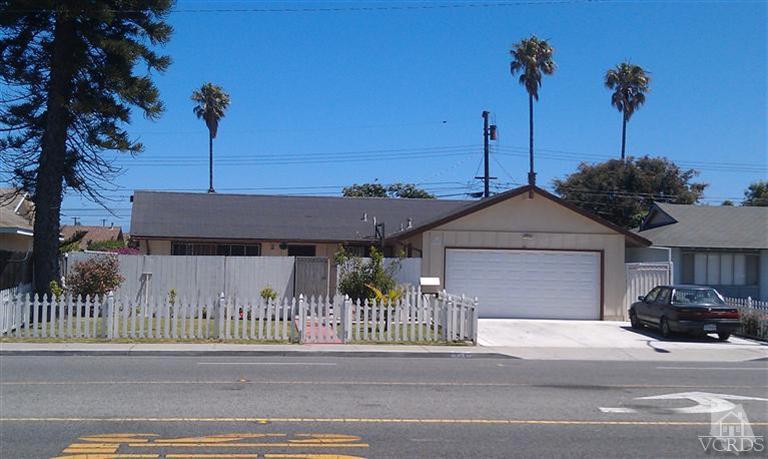 701 West Pleasant Valley Road Oxnard, CA 93033 - Photo 13 of 13 a front view of a house with a garden and entryway