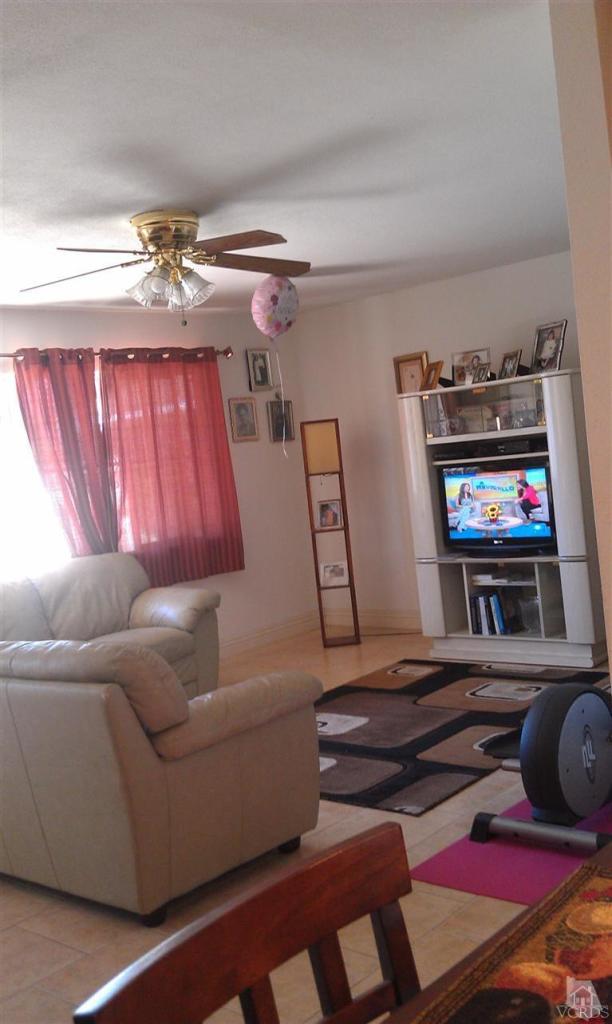 701 West Pleasant Valley Road Oxnard, CA 93033 - Photo 3 of 13 a living room with furniture and a flat screen tv