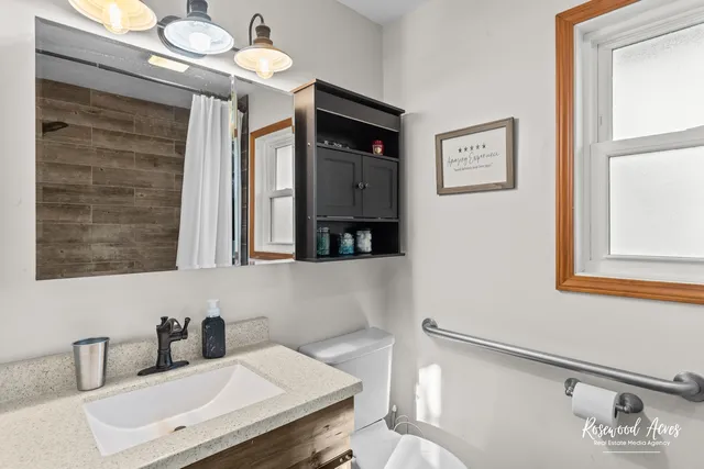 a bathroom with a sink and a mirror