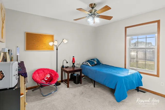 a bedroom with a bed and window