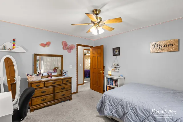 a bedroom with a bed and furniture