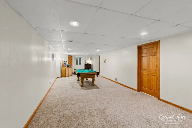 a view of work space with table and chairs