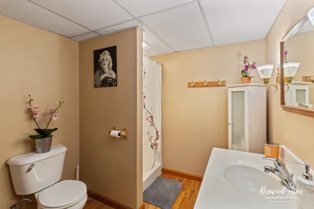 a bathroom with a sink toilet and shower