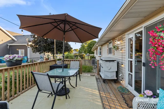 a patio with a patio table and chairs