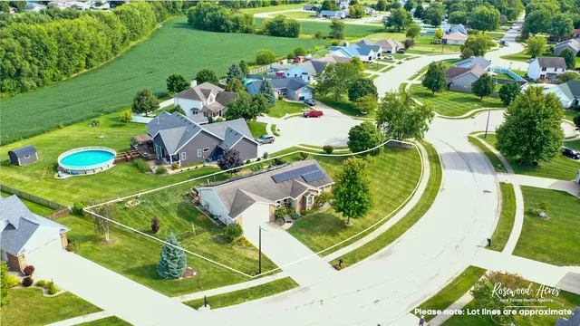 an aerial view of a pool yard swimming pool and outdoor seating