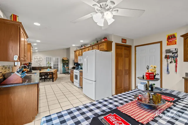 a very nice looking open dining room with a table and chairs