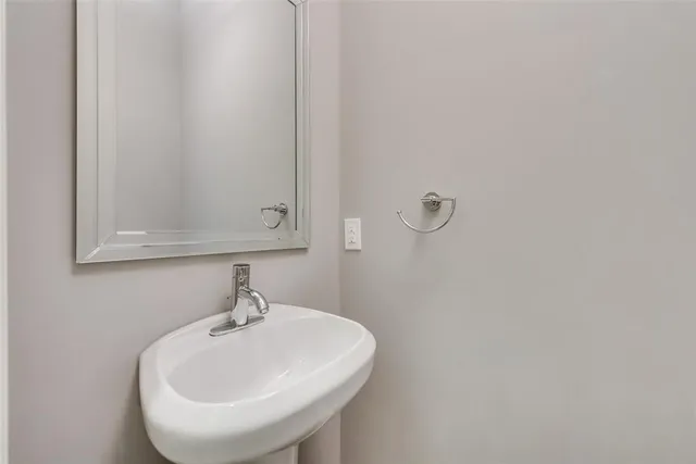 a bathroom with a sink and mirror