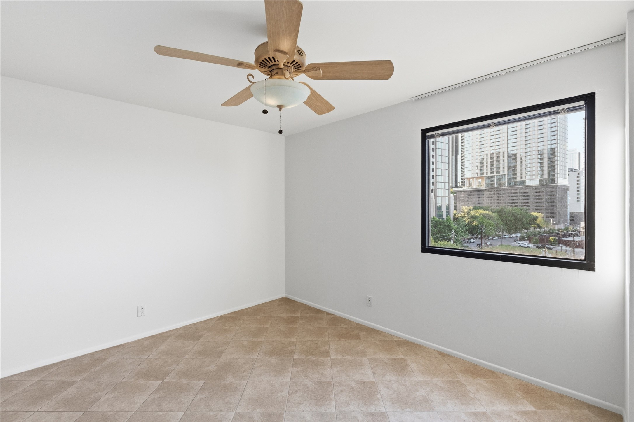 40 North Interstate Highway 35, Unit 7B1 Austin, TX 78701 - Photo 13 of 21 A quiet retreat in the 2nd bedroom with a sweeping city vista.