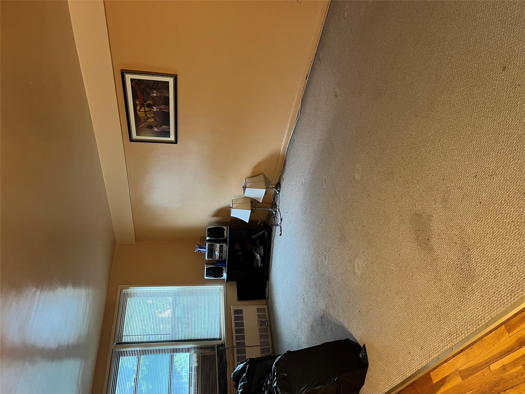 33-24 Junction Boulevard, Unit 3M Queens, NY 11372 - Photo 1 of 15 a view of a livingroom with furniture