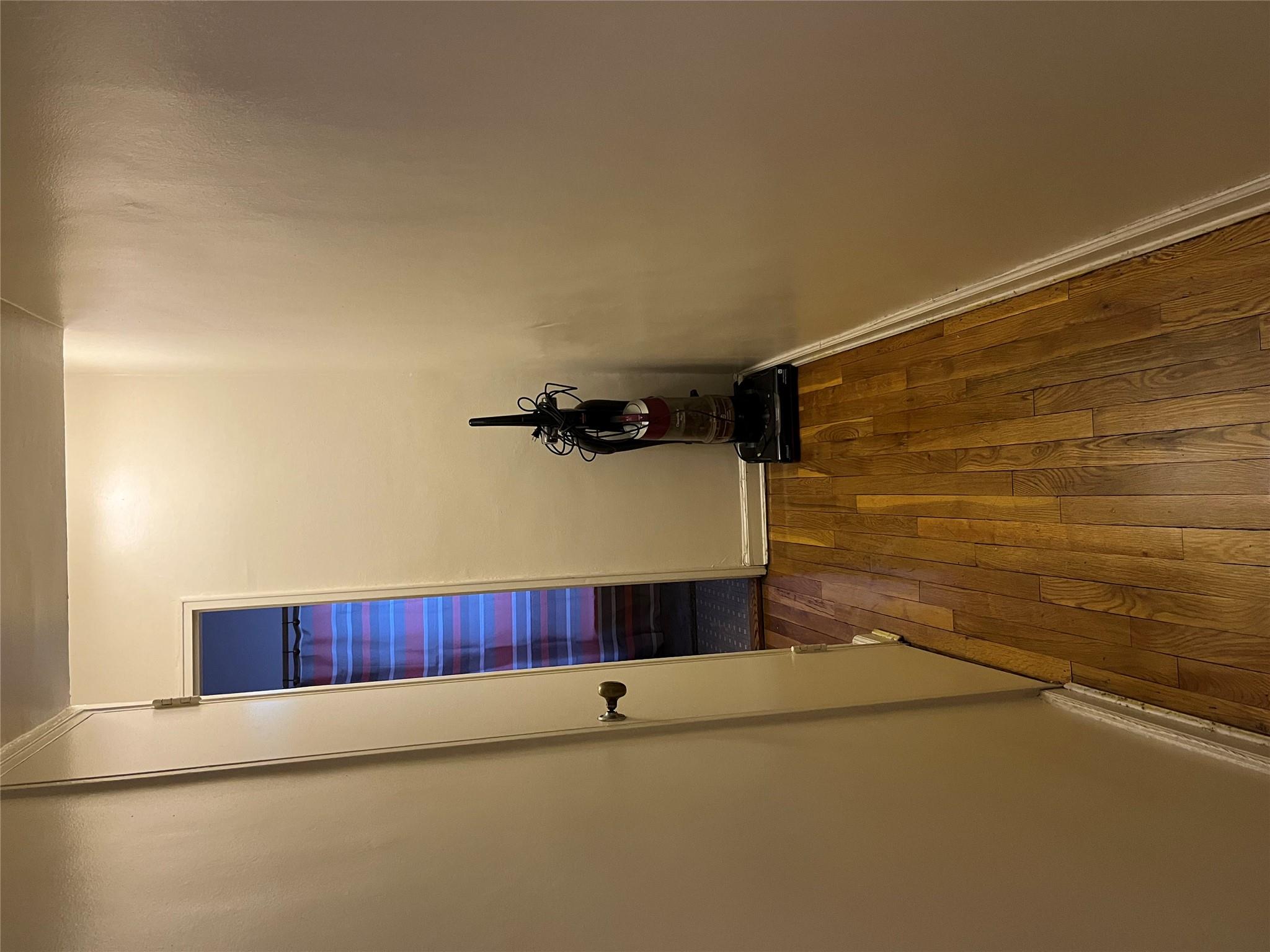 33-24 Junction Boulevard, Unit 3M Queens, NY 11372 - Photo 8 of 15 a view of a bathroom with wooden floor and a sink