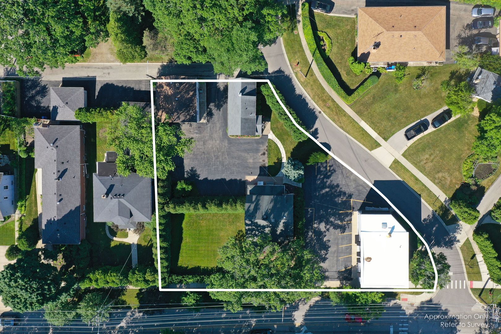 an aerial view of house with a yard