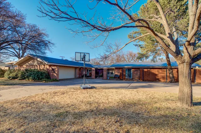 front view of a house with a big yard
