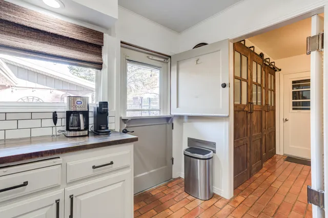 a kitchen with stainless steel appliances a refrigerator and a stove