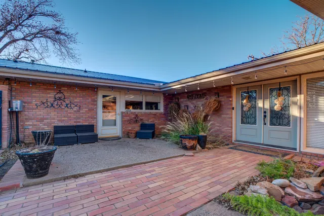 a view of a porch with seating space