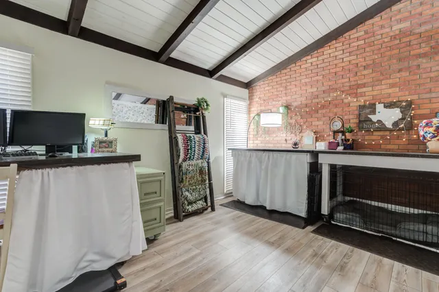 a view of entryway with wooden floor and workspace