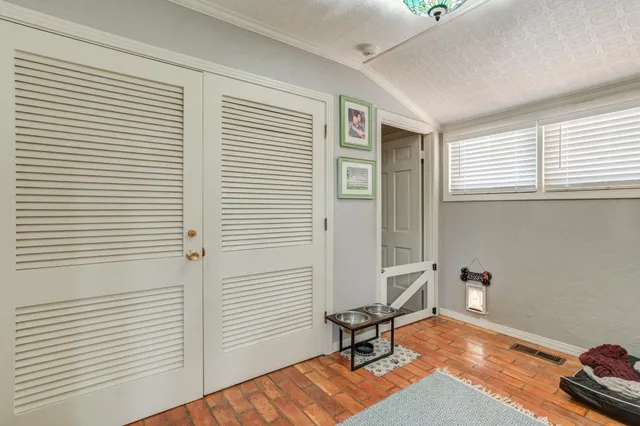 a kitchen with stainless steel appliances a sink and a window
