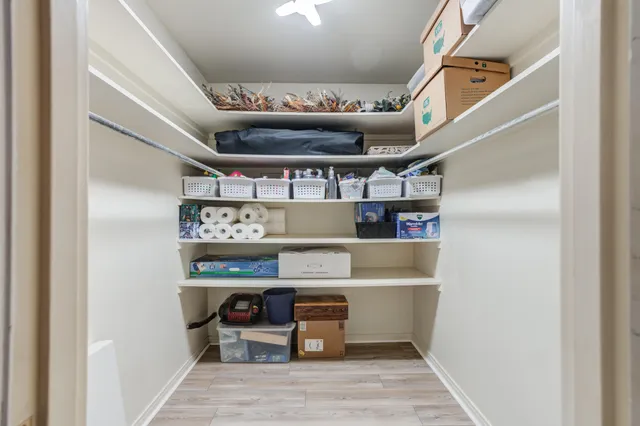 a view of a patio with table and chairs