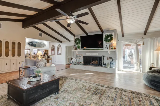 a living room with furniture and white walls