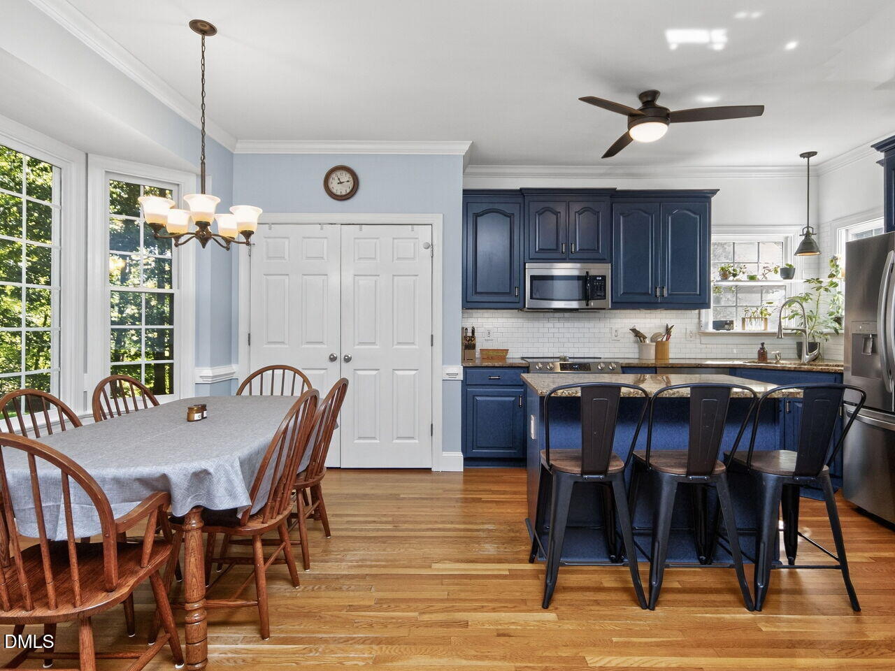 6736 Hammersmith Drive Raleigh, NC 27613 - Photo 13 of 42 a view of a dining room with furniture window and wooden floor