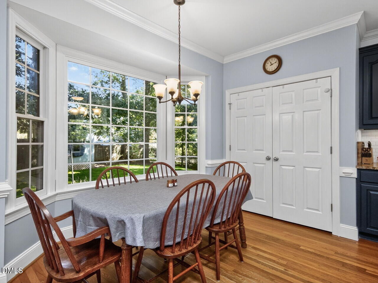 6736 Hammersmith Drive Raleigh, NC 27613 - Photo 14 of 42 a view of a dining room with furniture window and wooden floor