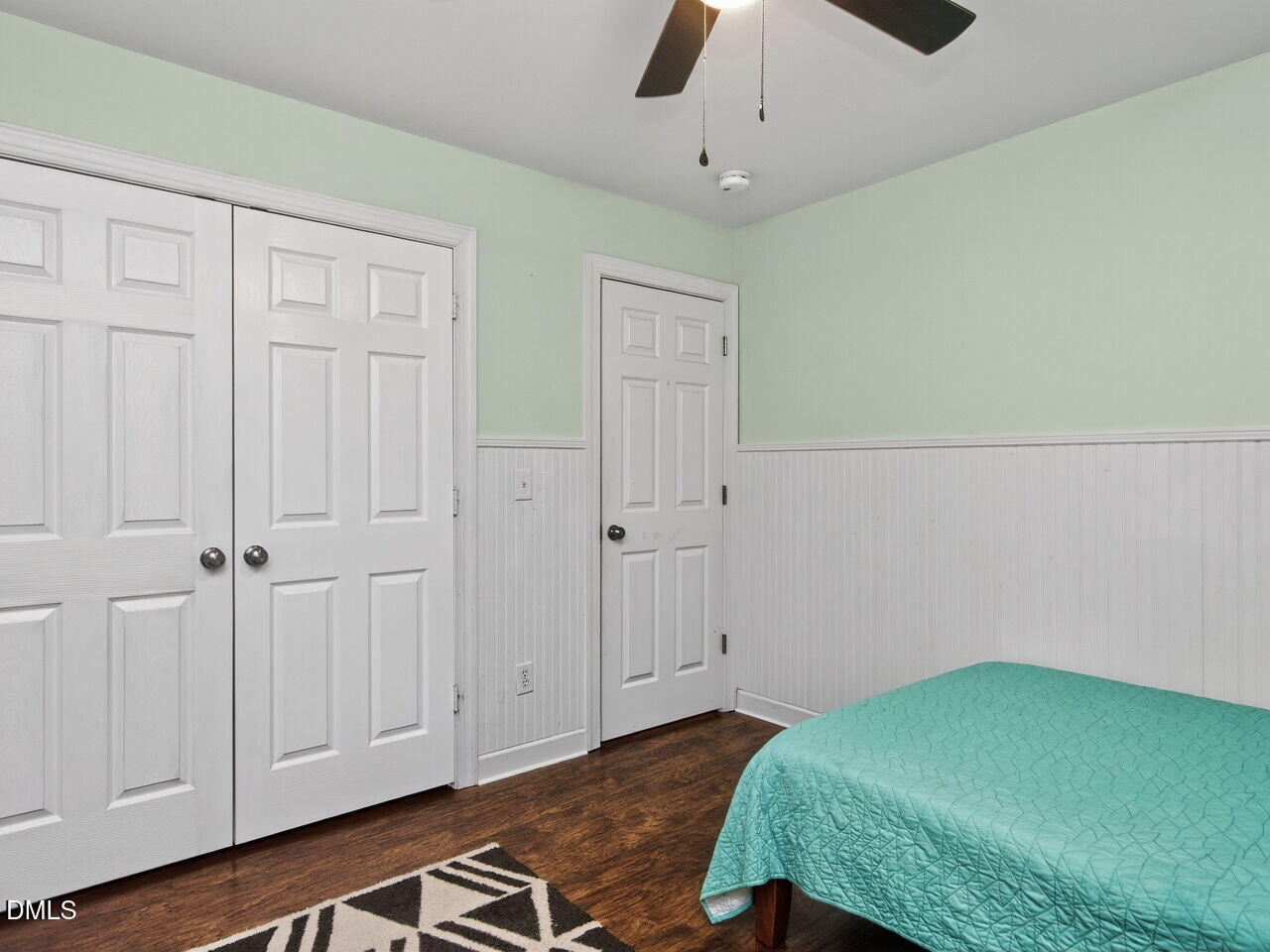 6736 Hammersmith Drive Raleigh, NC 27613 - Photo 27 of 42 a bedroom with a bed and a chandelier fan