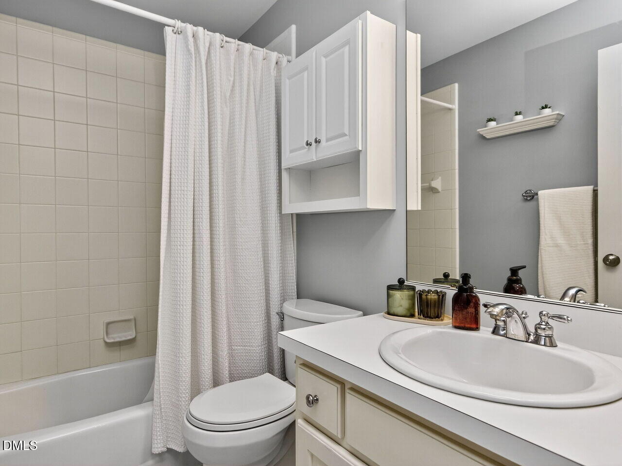 6736 Hammersmith Drive Raleigh, NC 27613 - Photo 28 of 42 a bathroom with a sink a toilet and shower