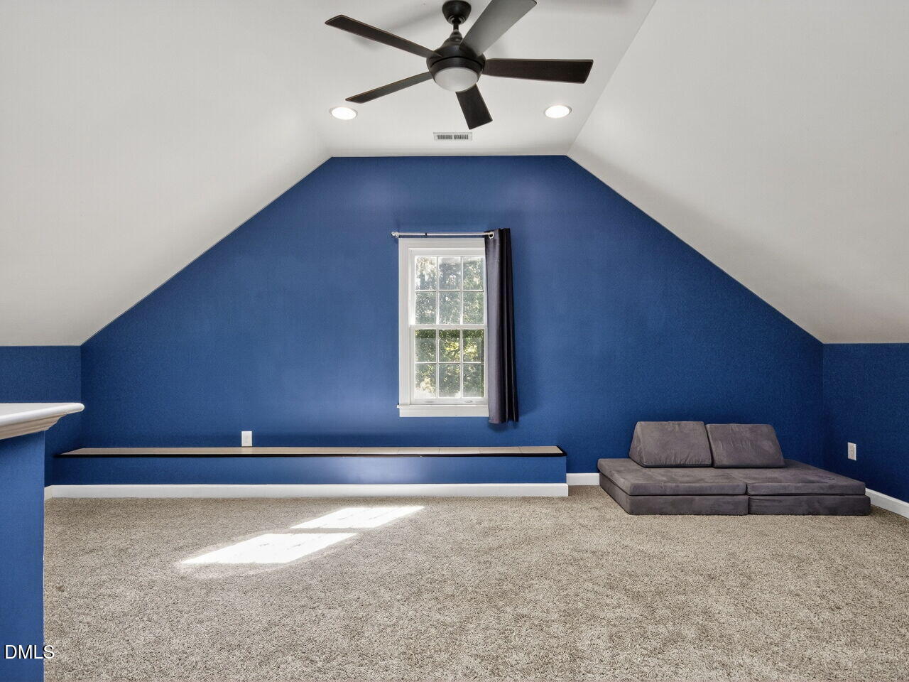 6736 Hammersmith Drive Raleigh, NC 27613 - Photo 33 of 42 a living room with furniture and a ceiling fan