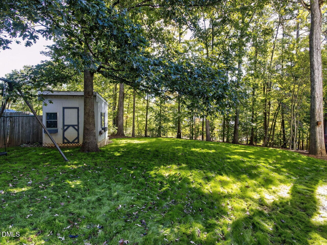 6736 Hammersmith Drive Raleigh, NC 27613 - Photo 38 of 42 a view of a house with yard and tree s