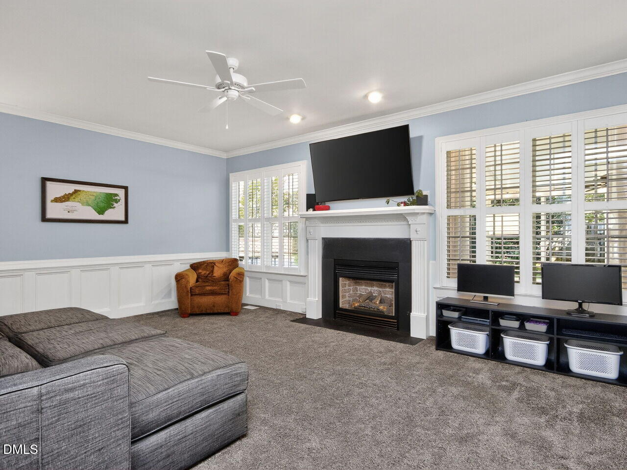 6736 Hammersmith Drive Raleigh, NC 27613 - Photo 7 of 42 a living room with furniture and a fireplace