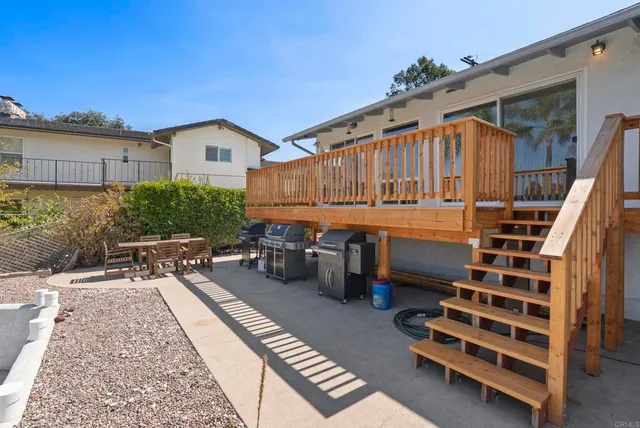a kitchen with stainless steel appliances granite countertop a sink refrigerator and cabinets