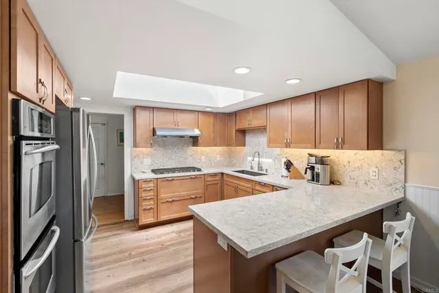 a view of a livingroom with furniture and a flat screen tv