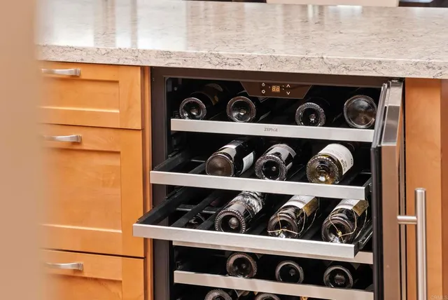a living room with furniture a flat screen tv and a large window