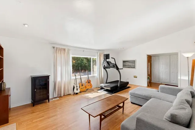 a bedroom with a bed and flat screen tv