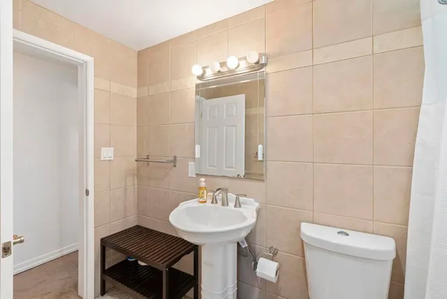 a view of a house with swimming pool and sitting area