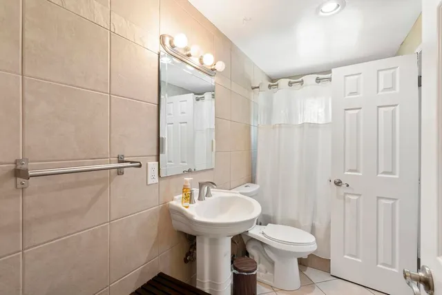 a view of a backyard with tree