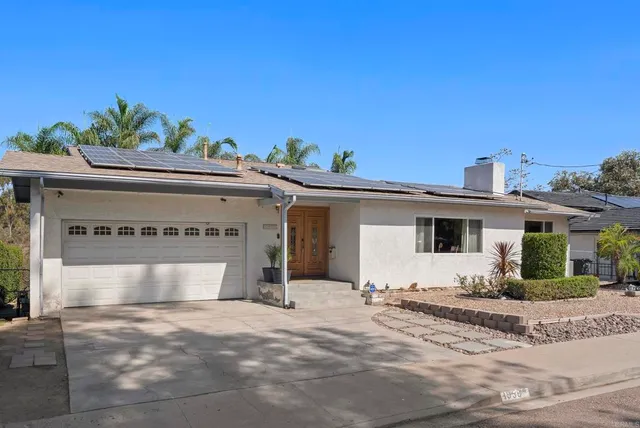 a view of a balcony with wooden floor