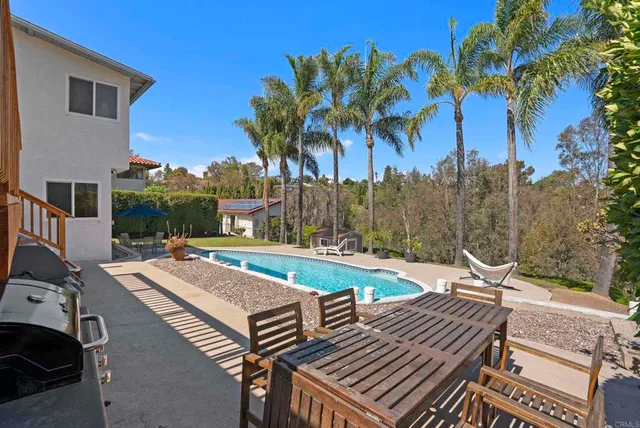 a front view of a house with a yard table and chairs