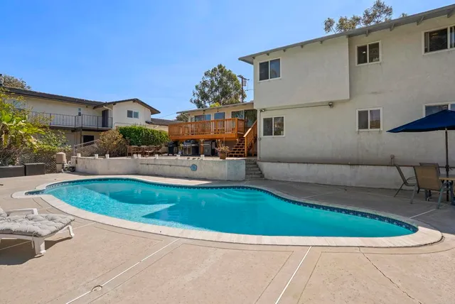 a view of a balcony with small garden