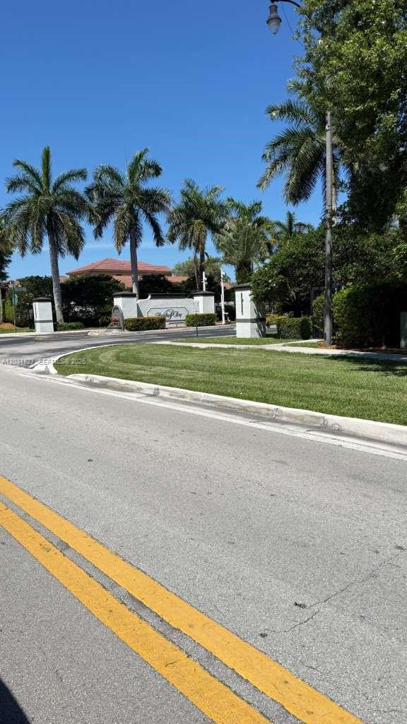 2120 Northeast 37th Road, Unit 1 Homestead, FL 33033 - Photo 7 of 30 a yellow house with trees in front of it