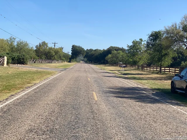 a view of a field with an ocean view