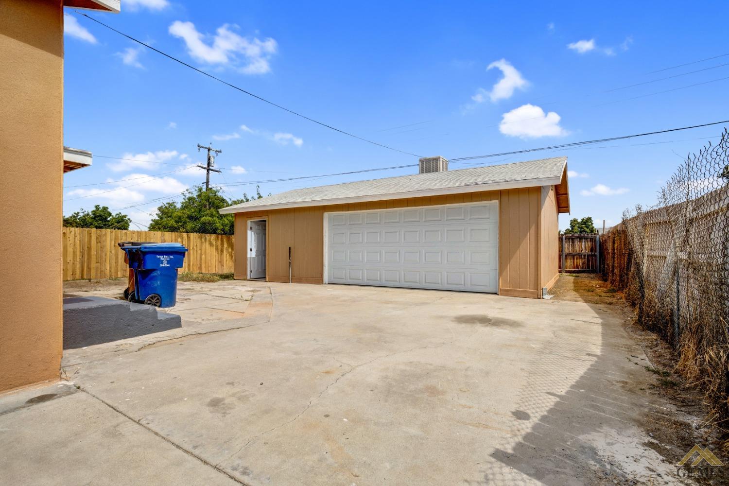 Undisclosed Address Bakersfield, CA 93308 - Photo 24 of 34 a view of a house with a garage