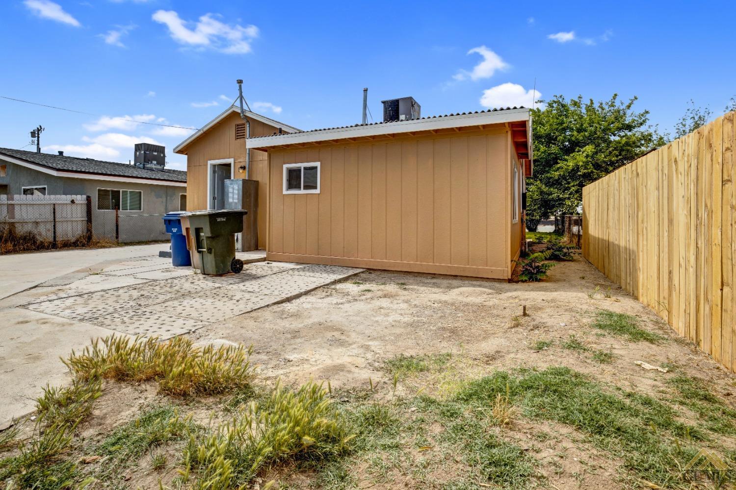 Undisclosed Address Bakersfield, CA 93308 - Photo 31 of 34 a view of a house with backyard and trees