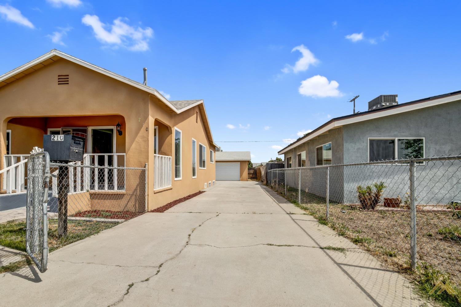 Undisclosed Address Bakersfield, CA 93308 - Photo 34 of 34 a front view of a house with a yard