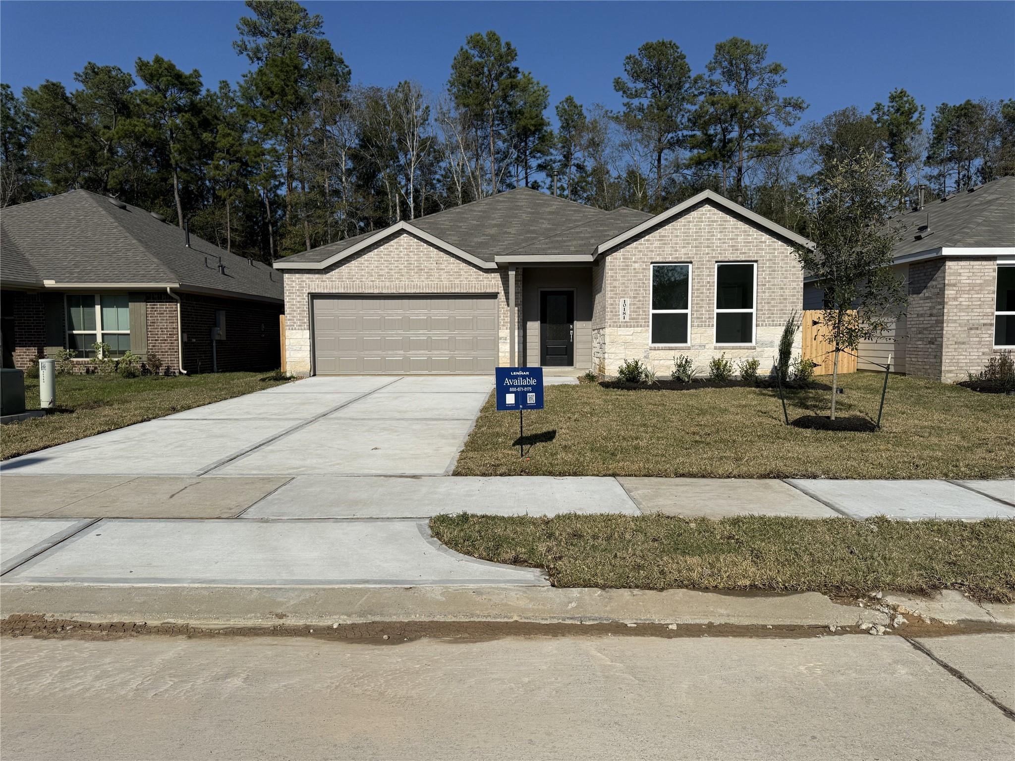 201 Orchard Cove Snook, TX 77879 - Photo 14 of 22 a front view of a house with a yard