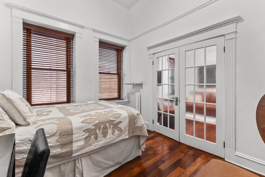 8 Garrison Street, Unit 100 Boston, MA 02116 - Photo 22 of 26 a bedroom with a bed next to a window