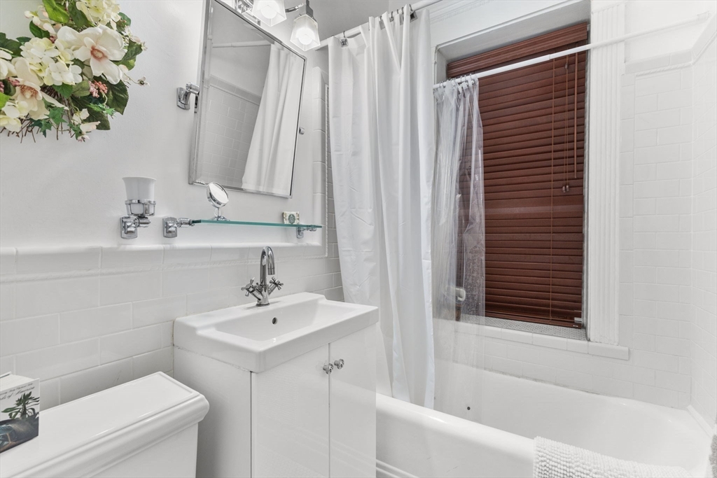 8 Garrison Street, Unit 100 Boston, MA 02116 - Photo 7 of 26 a bathroom with a sink a toilet and a bathtub