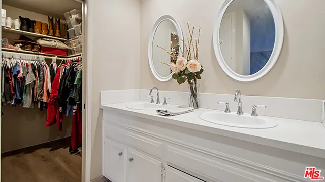 a bathroom with a mirror and sink
